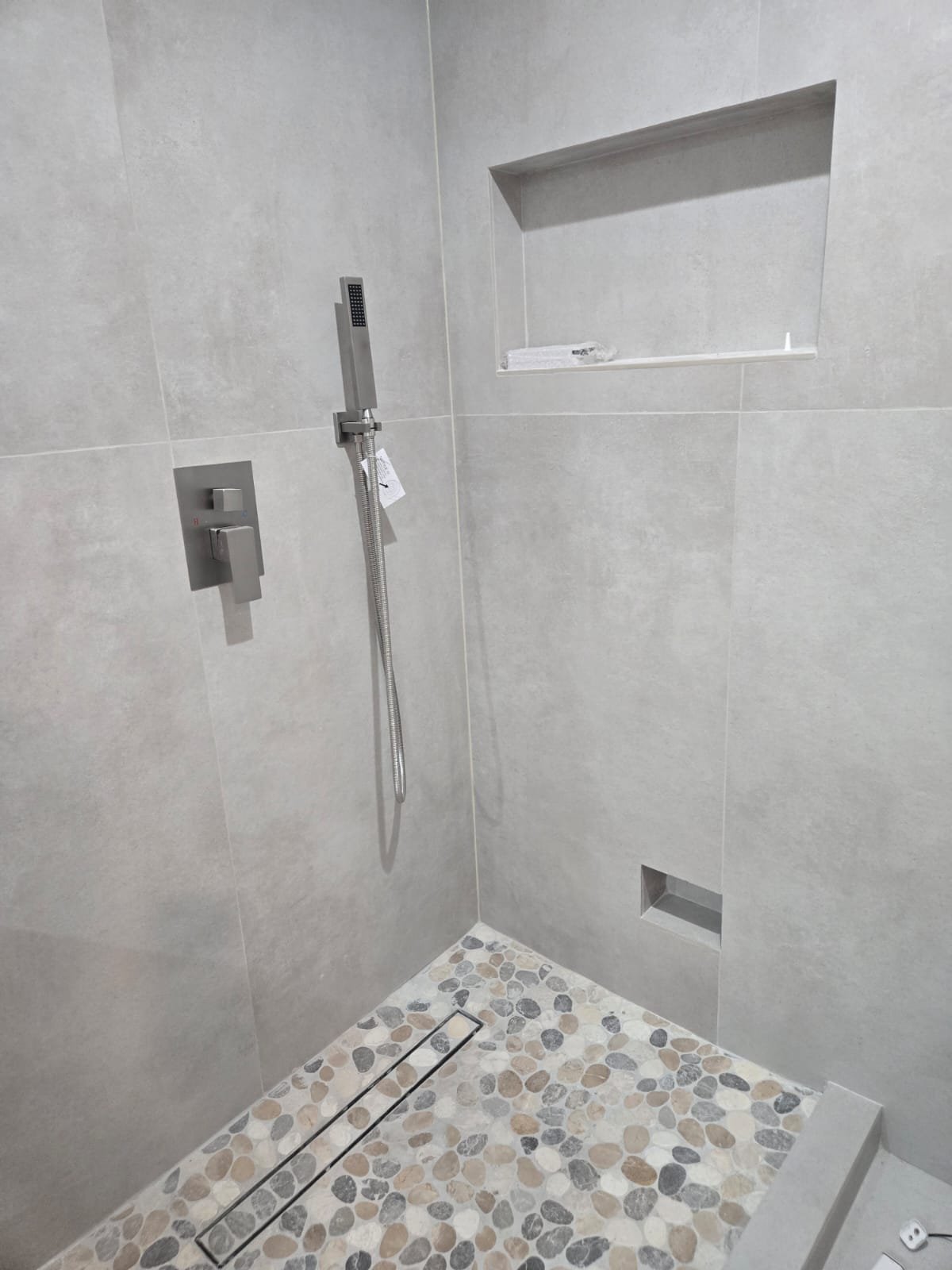 Curbless pebble shower and luxury master bathroom in Sherman Oaks CA by Ararat Builders Corp