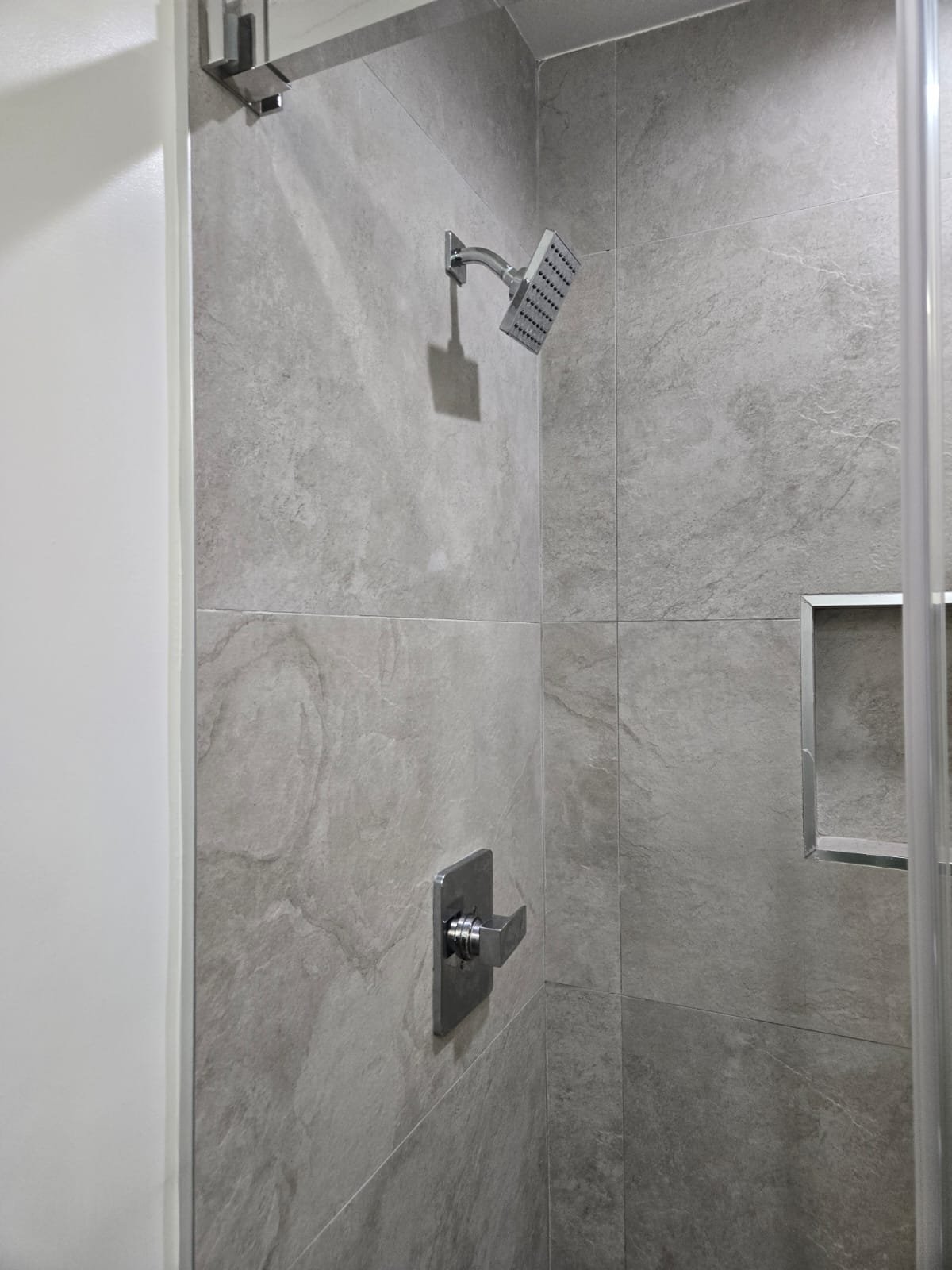 Modern square rain shower and luxury bathroom remodel in Studio City CA by Ararat Builders Corp